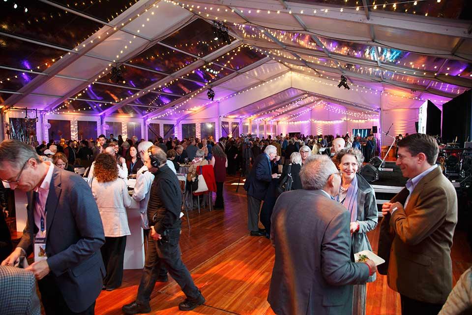 People celebrating inside the gala tent